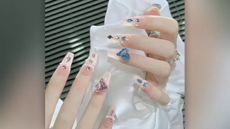 These manicures are fit for a princess with their sweet and candy colors and big diamond decorations. 