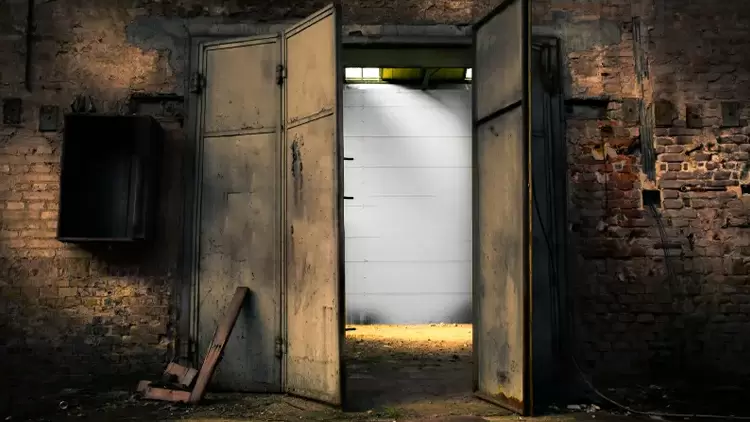 At the entrance of an abandoned factory, what catches your attention first?