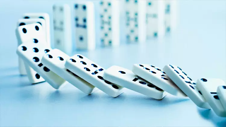 You spent a week carefully setting up dominoes, but a gust of wind caused them to topple over.