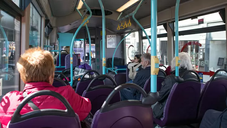 On the bus, you hear people talking about a movie you love. What will you do?